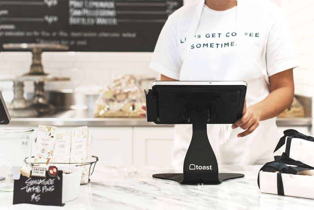 Toast POS Stock Photo Displaying their POS inside of a bakery