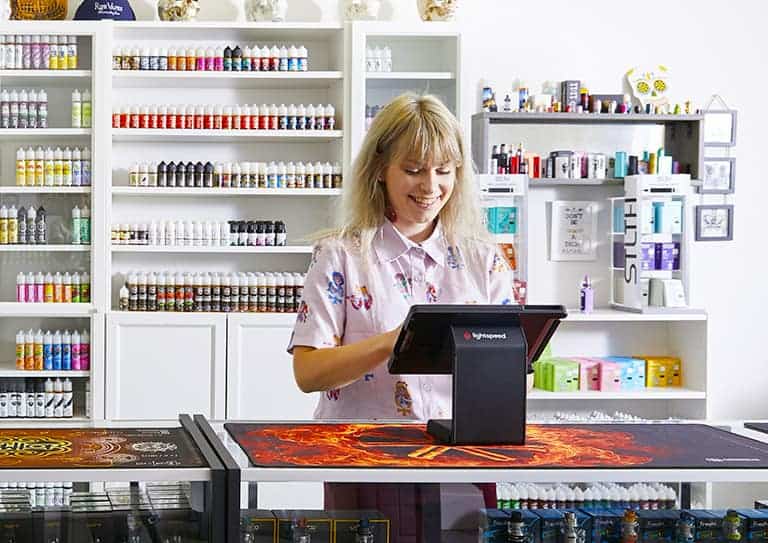 a person standing behind a counter in a store