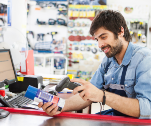 a hardware store employee ringing up an item 