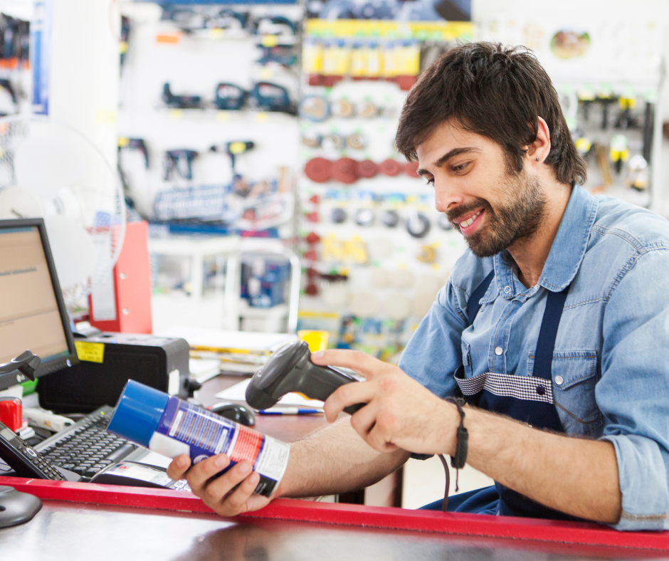 a hardware store employee ringing up an item